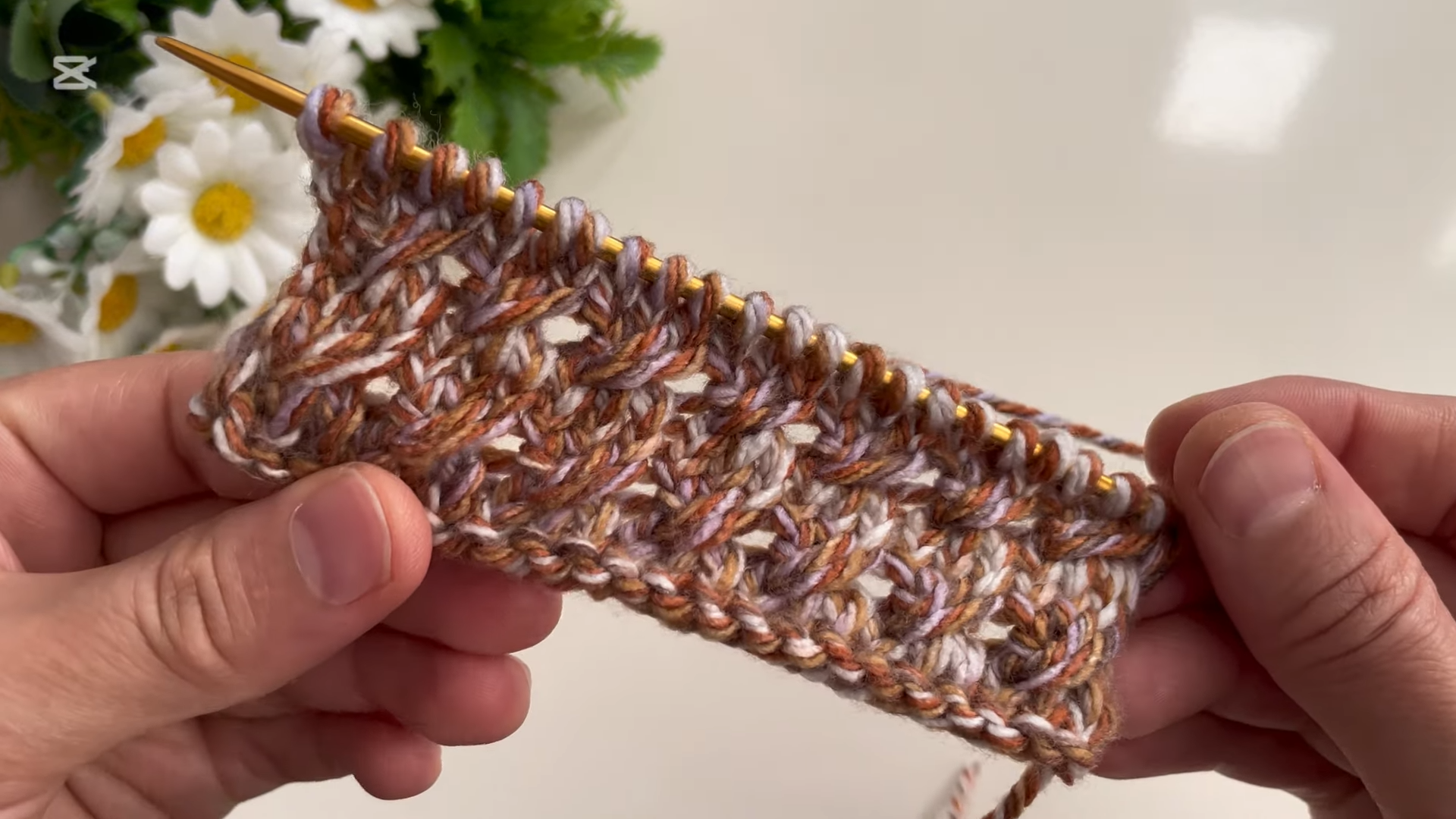 Elegant handmade baby vest - soft and neutral tones